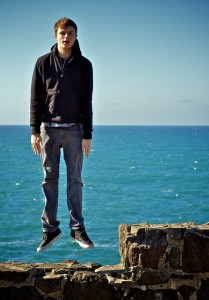 image of man stepping over the edge of a cliff