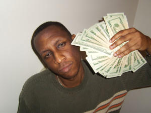 image of a man with a wad of cash