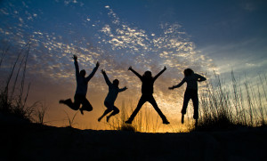 Happy jumping silhouettes
